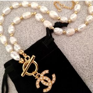 Pearl necklace with Pearl Logo , brand new .
